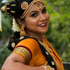 A stunning Brahmin bridal look, celebrating rich culture and tradition. The hairstyle, 9-yard saree drape, and makeup all come together to create an authentic and beautiful style.