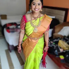 A happy bride on her special day. My goal is to handle all the styling details, from the saree draping to the final jewelry placement, so you can simply relax and enjoy your wedding.