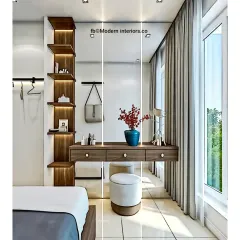 We created this modern dressing table setup within a bedroom. The floating vanity with drawers is paired with a tall, backlit mirror and a vertical shelving unit, providing a stylish and practical corner for makeup and accessories.
