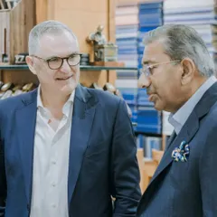 A conversation between leaders in the luxury textile and tailoring industries. This image captures a moment of shared vision during the visit from the Scabal executive team.