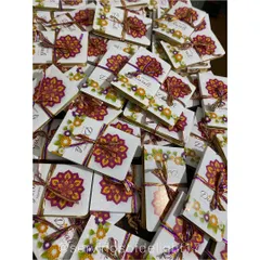 A whole batch of Diwali chocolate books, tied with colorful ribbons and ready to be delivered. I love seeing so many orders go out!