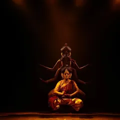 A meditative pose from 'Shrishti Stithi Laya', our production on the cosmic cycles of creation and dissolution. The dramatic lighting and serene posture evoke a sense of timelessness and divine order.