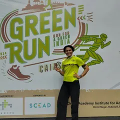 Posing with my medal at the Green Run. Running is always fun, but winning prize money makes it even more rewarding!