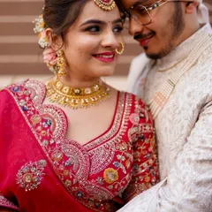 A close-up of a classic red bridal look. The focus is on creating luminous skin, beautifully defined eyes, and a bold lip that complements the traditional attire, ensuring the bride feels radiant and confident. ❤️