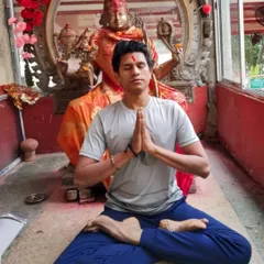 In a meditative pose at the Kamakhya Devi Temple, one of the 51 sacred Shakti Pithas. My practice is deeply connected to the spiritual heritage of India, offering a path to inner harmony.