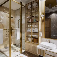 A master washroom designed for a high-end residence, featuring a luxurious walk-in shower with gold-finished fixtures and beautiful onyx-style tiles. The design creates a spa-like experience at home.