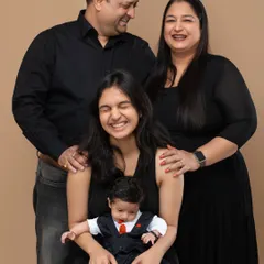 A beautiful multi generational portrait capturing the joy of a growing family. We love bringing everyone together, from grandparents to the newest little member, for a complete family photograph.