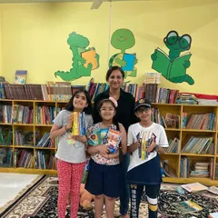 A happy group of Bookyardigans at the library, holding the books they've just discussed. Being in the physical space, surrounded by books, adds another layer of excitement to our club meetings.