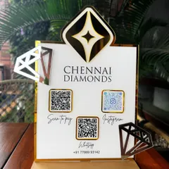 Another angle of the Chennai Diamonds stand, capturing the reflection on the gold accents and the professional layout of the payment and social media QR codes.