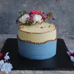 Modern, chic, and utterly captivating. Our fault line cakes, like this two-tone design with fresh floral arrangements, add a touch of contemporary artistry to any special occasion.