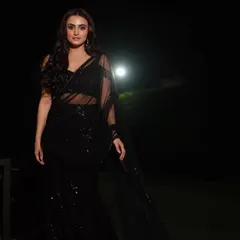 A full-length view showcasing the complete outfit and graceful posture. This type of event portrait is perfect for capturing the style and glamour of your guests.