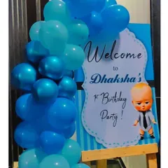 Greet your guests in style with a personalized welcome board. This Boss Baby themed sign on a wooden easel, complete with a matching balloon garland, sets the tone for the party right from the entrance.