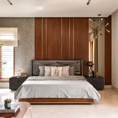 Your bedroom should be your personal sanctuary. For this space, I layered different textures like the wood-paneled accent wall, a soft upholstered headboard, and rich fabrics to create a warm and inviting atmosphere. The goal was to design a room that feels like a true retreat from the hustle of daily life.