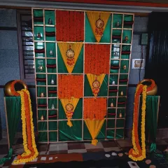 A darker, more atmospheric shot of the Bangle ceremony backdrop, highlighting the colors and textures.