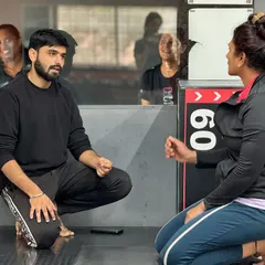 A successful fitness journey starts with a conversation. Here, one of our trainers discusses goals and progress with a client, ensuring the plan is always aligned with her needs. This is the foundation of our one on one training.