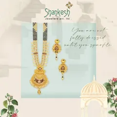 This mangalsutra set, complete with matching earrings, features a traditional pendant design with intricate gold work, offering a complete and attractive package for customers.