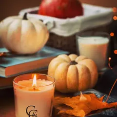 Embrace the cozy feeling of autumn with a warm, scented candle. This jar candle, featuring my C&C logo, is perfect for the fall season, surrounded by pumpkins and autumn leaves to create a comforting atmosphere.