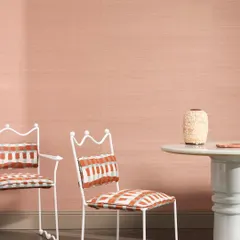 The 'Abaca' wallcovering by Nobilis, crafted from handwoven plant fibers. This image showcases its refined, natural texture in a soft pink hue, bringing an earthy and organic elegance to the space.