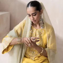 A close-up from the Saisha shoot, focusing on the details. This shot highlights the intricate embroidery on the yoke of the kurta and shows how I pair statement jewelry, like these large silver-tone earrings, to complete the ethnic look.