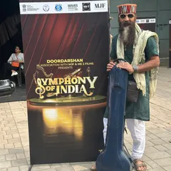 Standing with my instrument case at the 'Symphony of India' event. This initiative celebrates the unity in our diverse cultures, weaving them together like a beautiful melody.