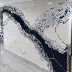 Another angle of the custom Calacatta-style marble wall finish, showing how the design flows across the entire surface. This technique provides the look of expensive marble at a fraction of the cost.