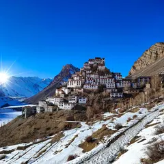 The iconic Kee Monastery in Spiti Valley, perched under a brilliant blue sky. This shot captures the scale and spiritual serenity of the Himalayas, a perspective only possible with high-altitude landscape photography.