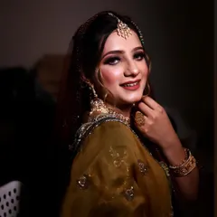 Adding the finishing touches for the big day. This is a beautiful, classic look for a family member, featuring a soft smokey eye and a warm, glowing complexion.