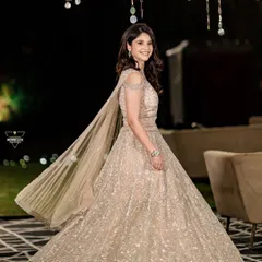 A stunning portrait of the bride-to-be in her glittering gown. The twirl shot perfectly captures the elegance and flow of her beautiful engagement outfit.