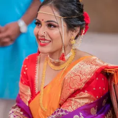 That beautiful bridal smile! This close-up shows the details of her 'vidhi' look, including the traditional 'mundavalya' and nose ring, all complemented by fresh, glowing makeup.