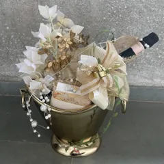 A duplicate of ID 93, this image showcases our stunning champagne bucket gift arrangement, a perfect centerpiece for a milestone celebration.