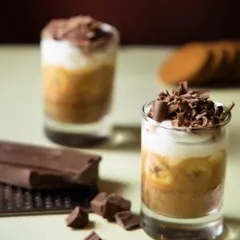 The Banoffee Pie of your dreams. Layers of banana, toffee, and cream, topped with chocolate shavings for a truly decadent dessert.