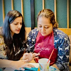 "Just begin." That's the first and most important step. Here I am, giving some gentle guidance to a participant who was new to painting.