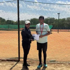 Kshitij Sinha, the runner-up, is awarded his medal and certificate. Our tournaments celebrate all levels of achievement, recognizing the hard work of finalists.