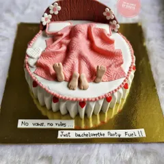 "No vows, no rules... Just bachelorette party fuel!" This cake features a couple under the covers, a funny and suggestive design perfect for a bride-to-be's last single celebration with her friends.