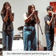 A trio of our talented vocalists performing at a showcase at Lodha Park. We work with students on harmonies, microphone technique, and stage presence to help them deliver powerful vocal performances.