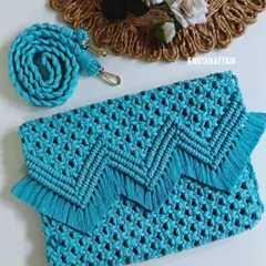 For a more elegant and chic look, I created this beautiful turquoise sling bag. It can be used as a clutch or a purse and shows the versatile side of macrame. The intricate knotting and fringe detail make it a statement piece for any occasion.