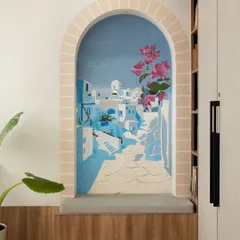 A small nook in a master bedroom becomes a window to Santorini. This scenic mural is designed to transport you, creating a personal seaside retreat and a serene escape within your own home.
