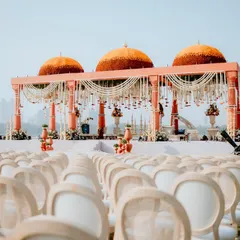 I love creating mandaps that honor timeless traditions while making a grand statement. For this ceremony, I designed magnificent marigold domes set against the city skyline, blending cultural richness with modern luxury for a truly regal wedding.