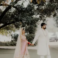 A simple walk, hand in hand, becomes a profound moment. Shreya and Rahul at Mallu Farms, stepping into their future together, framed by nature.