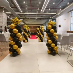 We designed these elegant black and gold balloon pillars to line the main aisle for the Swiggy awards ceremony. Topped with gold star balloons, they created a grand, VIP-style entrance for all the attendees and award winners.