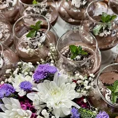 My rich and luxurious chocolate mousse, garnished with fresh mint and served in beautiful glassware. It's a perfect dessert for intimate dinners or any special celebration.