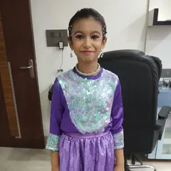 A full view of the themed makeup for this young dancer. The sequined outfit and the crystal eye makeup create a magical and coordinated look.