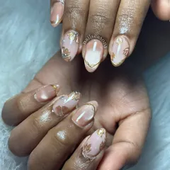 The complete look of this stunning bridal manicure. The combination of hand-painted art and the cat eye effect creates a design that is both traditional and modern.