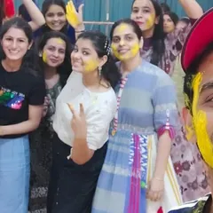 A selfie moment during the Holi fun. The energy and smiles say it all.