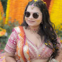 A close-up of the Haldi bride. Her makeup is minimal, with a focus on clean skin and defined eyes, allowing her natural beauty to shine.