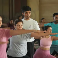 An instructor guides a large group during our Yoga Day celebration. It's a thrill to lead so many enthusiastic students in a shared practice.