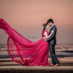 A perfect pre-wedding moment captured at sunset. This pink trail gown stands out against the ocean backdrop, and its fabric is ideal for creating that windswept, romantic look that couples love for their beach photoshoots.