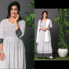 A composite image of a model in a white and black printed anarkali suit, set against a grey background with studio props for a lifestyle feel.
