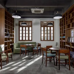 This cozy nook within a transformed heritage building at Woodstock School serves as a quiet space for study and collaboration. We restored the original windows and used natural materials to create a warm, inviting atmosphere that connects students with their surroundings.