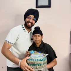 A happy moment from our student meetup. It’s a joy to reward my dedicated students for their progress and see them smile. That's the YouTube Silver Play Button in the background, all thanks to them.